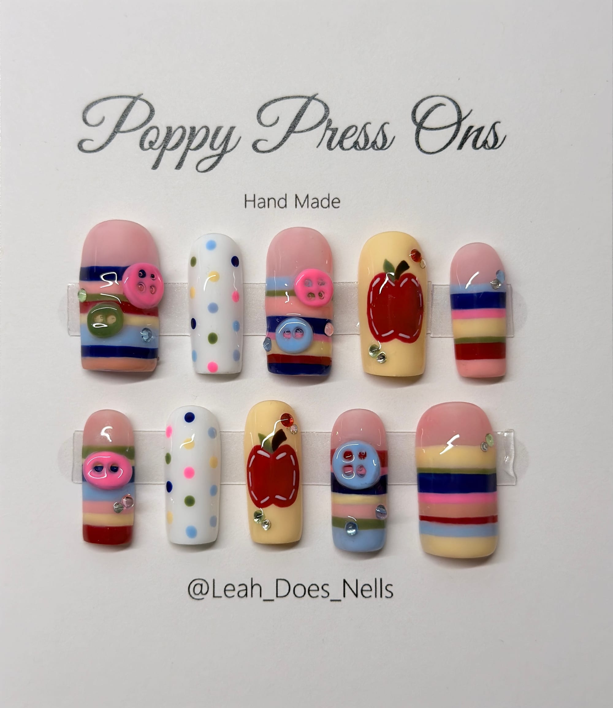 Buttons, stitched apples, rhinestones, and stripes