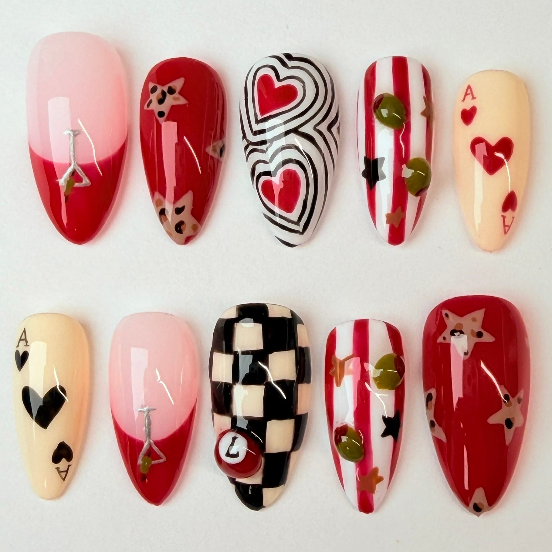 Stars, hearts, 3D olives, ace of hearts cards and checkered nails
